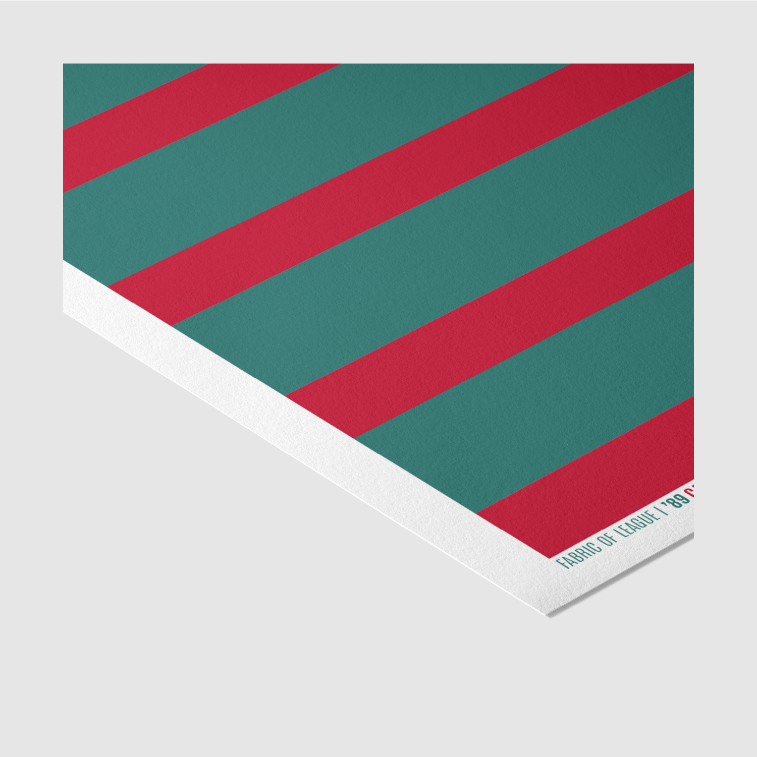 Rugby league wall art print in red and green hoops – angled corner view.