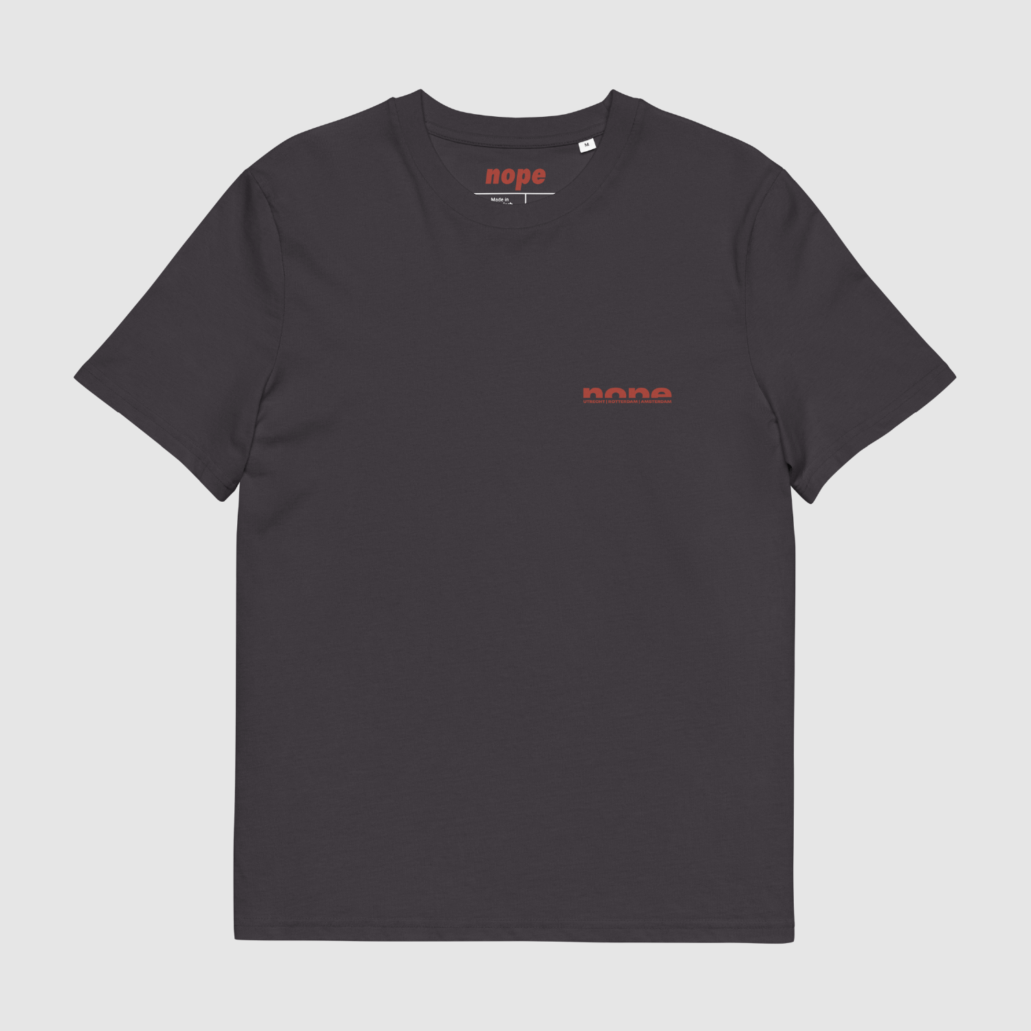 Front view of anthracite Nope T-shirt with small red chest logo — minimalist streetwear essential