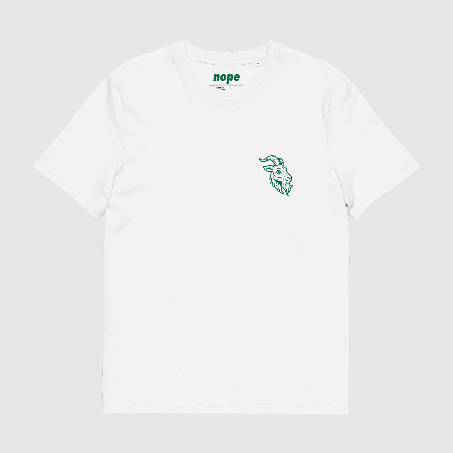 Front view of white Zero Fuchs Eisbock tee featuring green Alpine goat emblem and clean design layout.