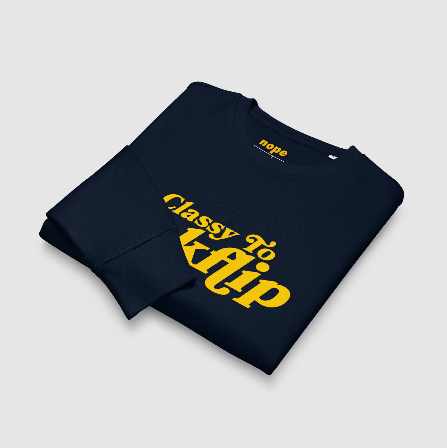 Folded Product: Folded navy sweatshirt showing bold yellow kickflip graphic and neck branding