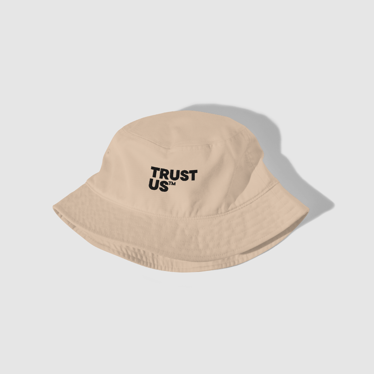 Trust Us™ Bucket Hat – angled front perspective showing embroidery detail