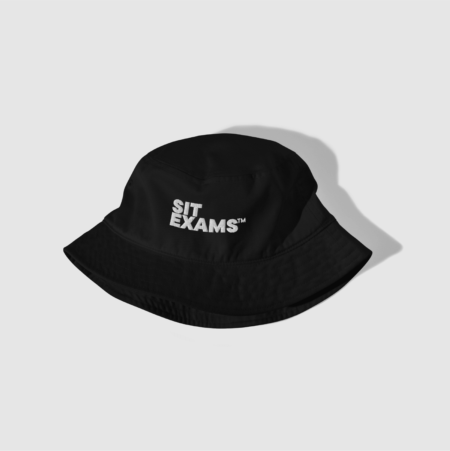 Angled view of black Sit Exams™ bucket hat by Mr. Nope
