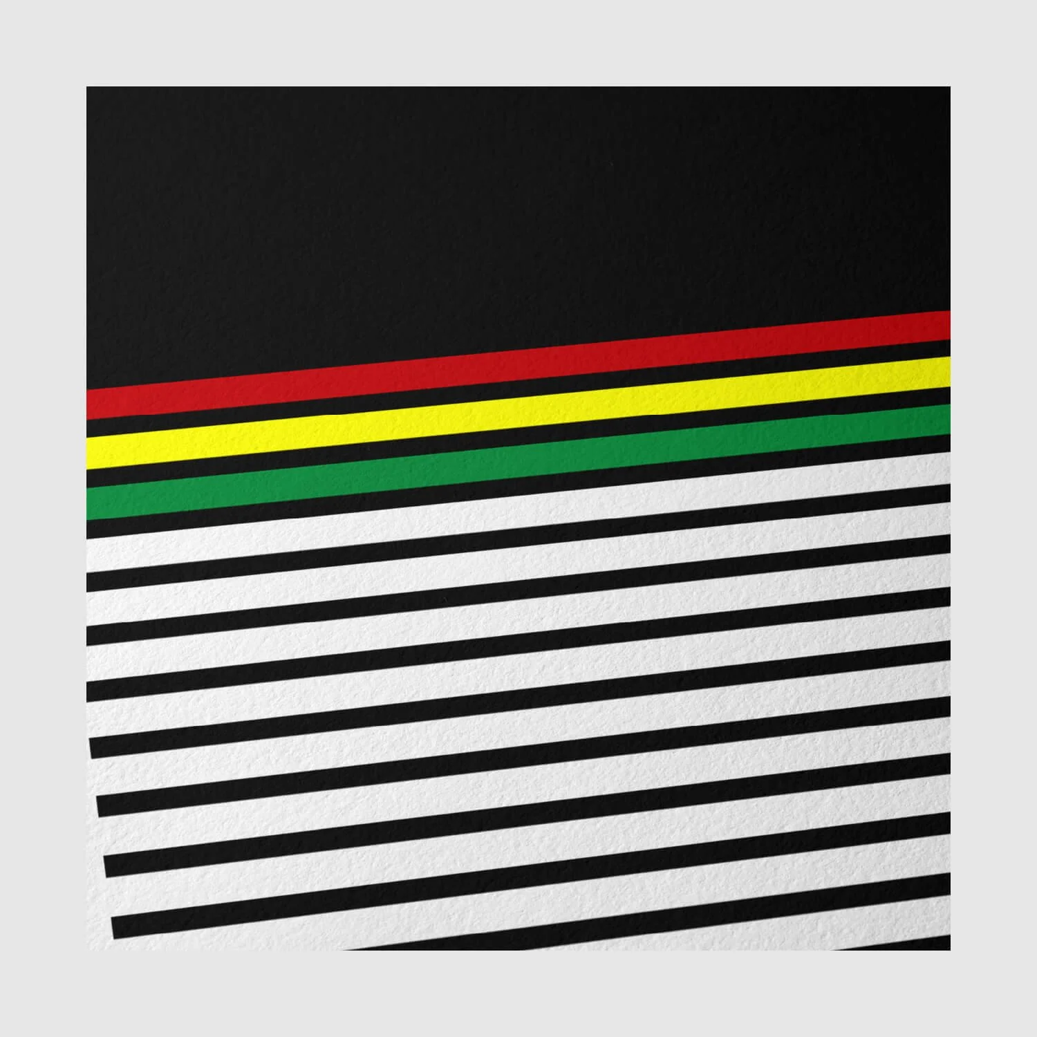 Close-up detail of Fabric of League Black with Stripes ’91 print showing red, yellow, and green striping on matte paper