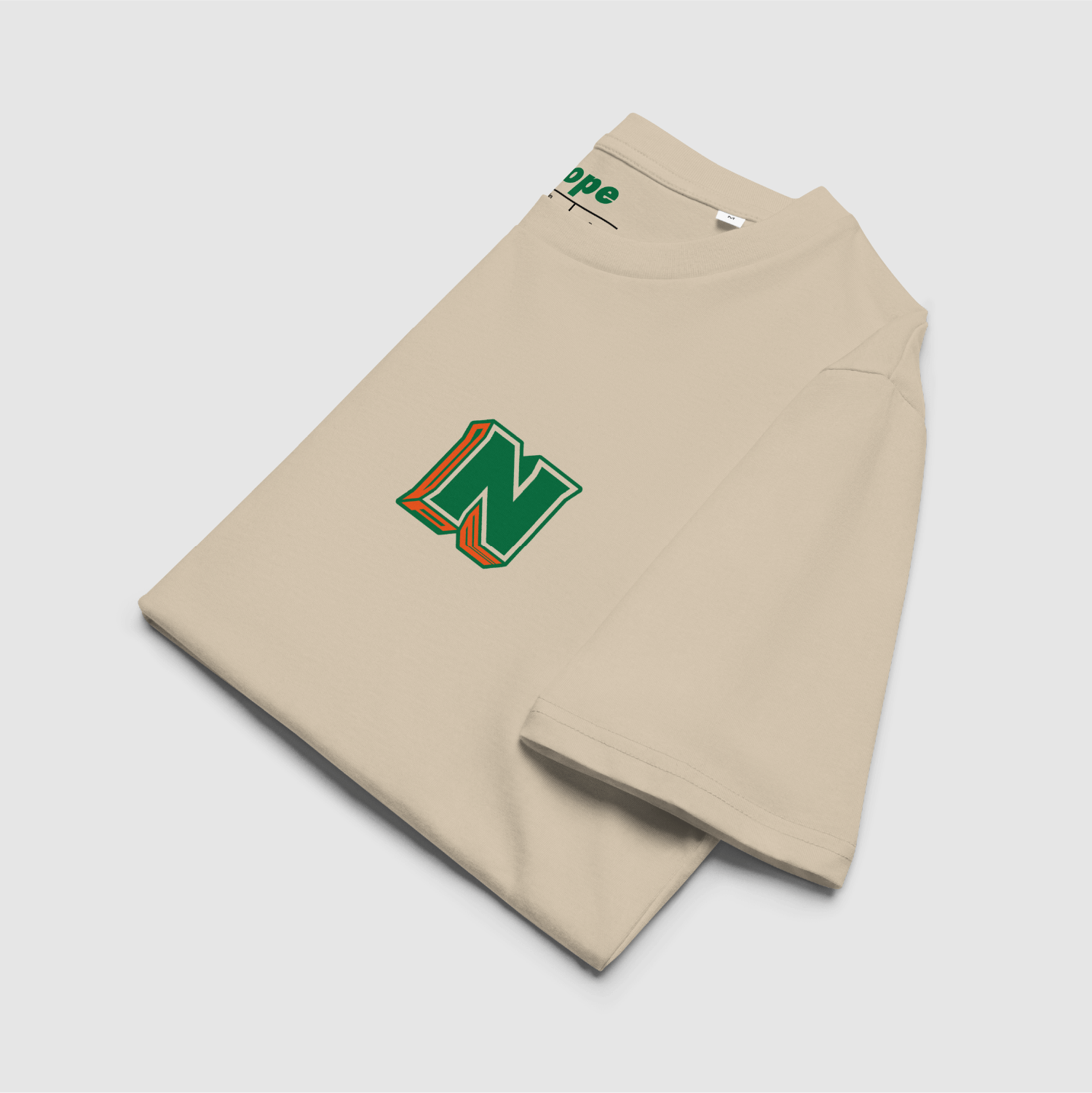Folded Desert Dust T-shirt showing front logo and branded collar print