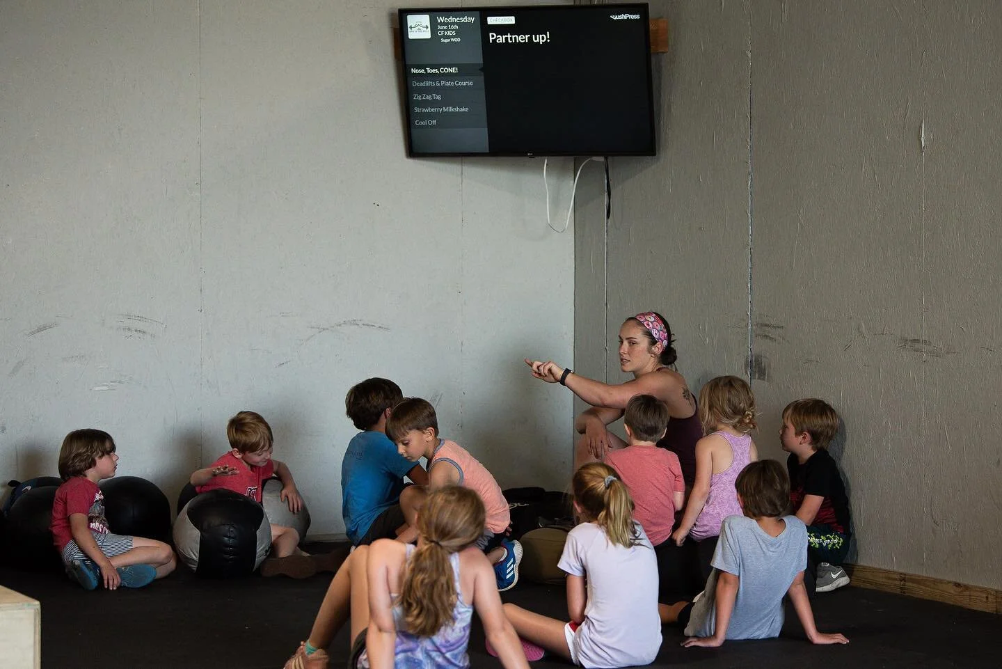 &ldquo;What will my kid be doing at CrossFit Kids?&rdquo;

1. They will be learning how to work alongside a team or a partner almost everyday. 
2. They will be learning skills such a running, jumping, balance &amp; coordination. 
3. They will do &ldq