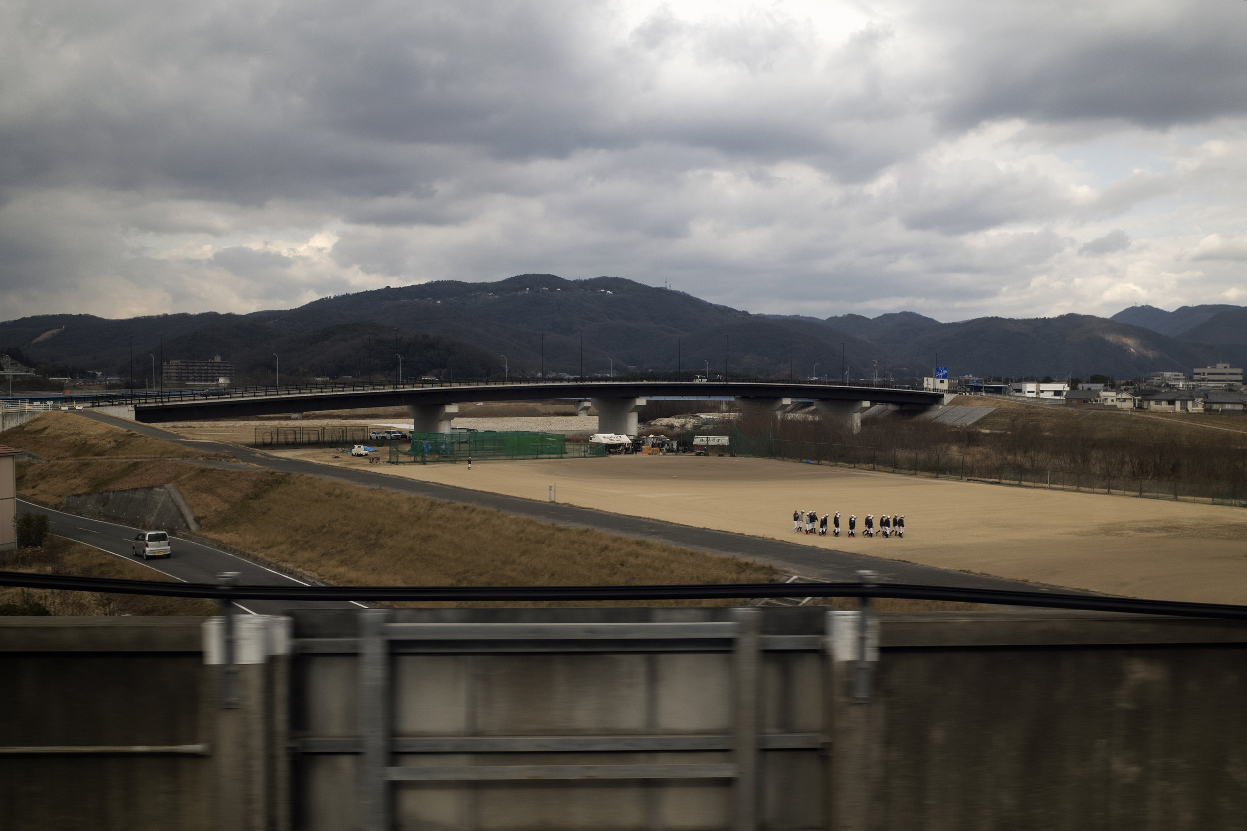  Men gather for a baseball practice in Okayama, Japan (Taken on the Shinkansen bullet train) 