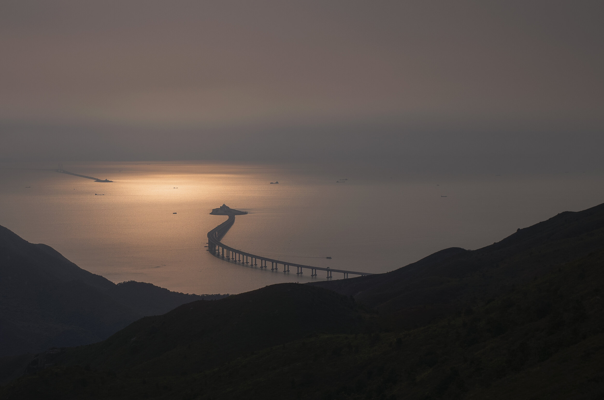  An aerial view of the Hong Kong–Zhuhai–Macau Bridge is seen at dusk off Lantau island, Hong Kong (Picture was taken from a cable car ride) 