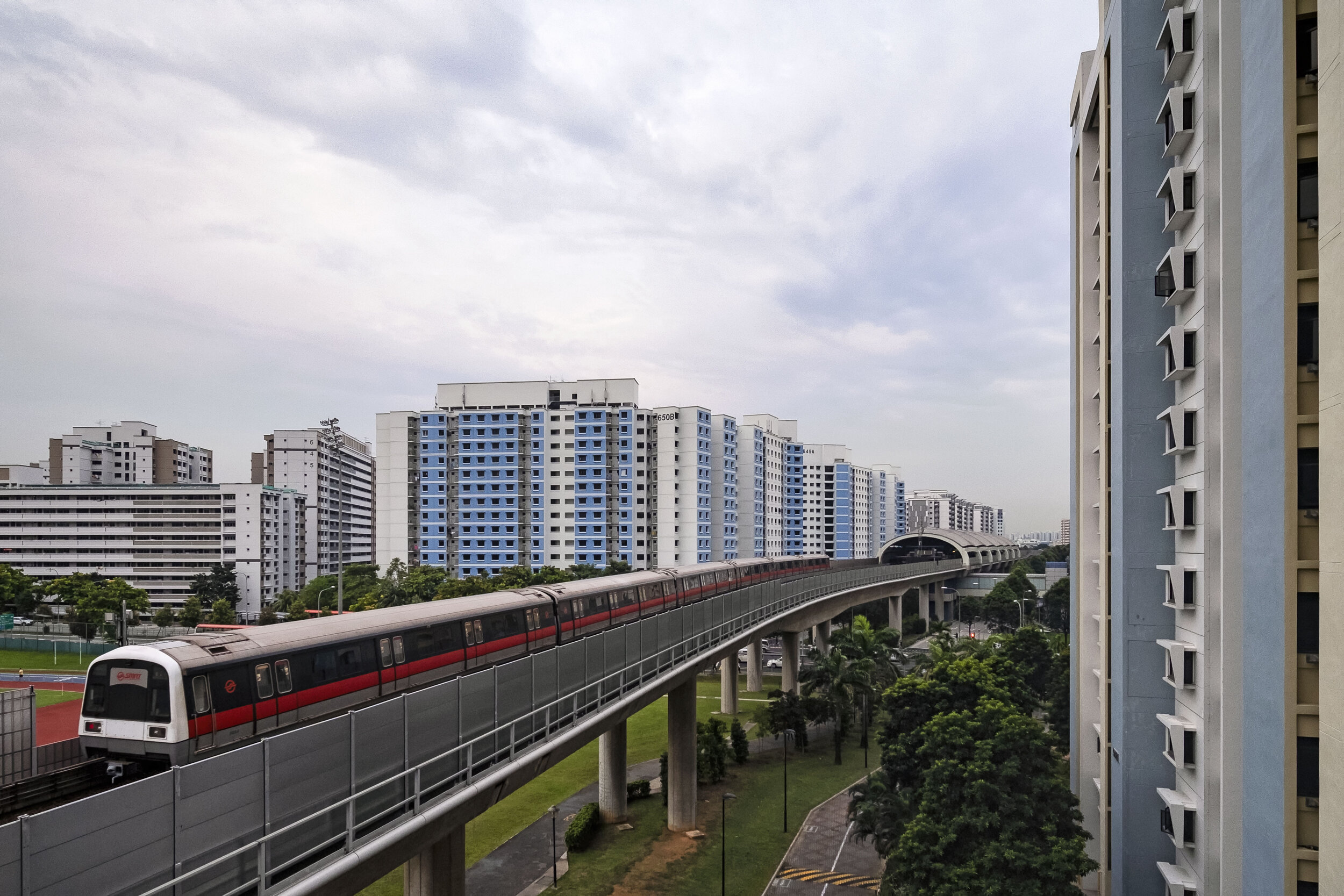  A SMRT train passes by public housing flats as it travels towards Pioneer station in western Singapore 