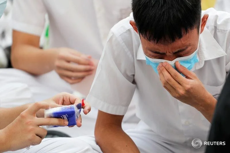  A schoolmate of a student protester who was shot by a policeman on Tuesday cries while participating in a student gathering at Tsuen Wan Public Ho Chuen Yiu Memorial College in solidarity with the student in Tsuen Wan, Hong Kong, China, October 2, 2