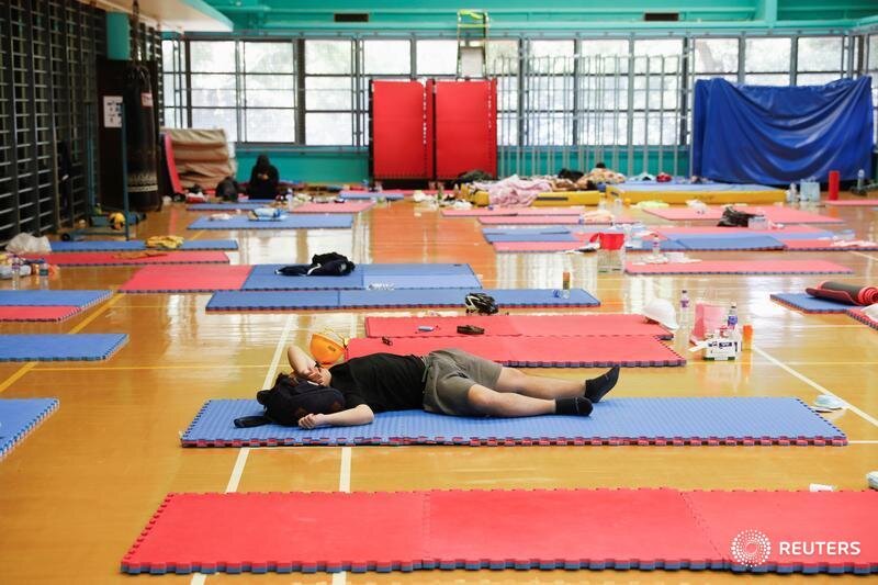  An anti-government demonstrator rests in a sports hall during protests at the Polytechnic University in Hong Kong, China, November 16, 2019. REUTERS/Adnan Abidi  