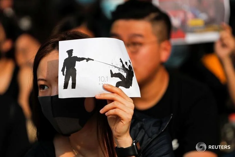  An alumna of Tsuen Wan Public Ho Chuen Yiu Memorial College participates in a student gathering in the school in solidarity with the student protester who was shot by a policeman on Tuesday in Tsuen Wan, Hong Kong, China, October 2, 2019. REUTERS/Su