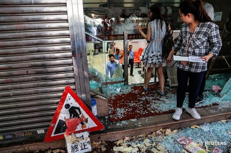  Employees of China Travel Service, a tourism and travel agency of the China government, are seen at their vandalized office in Tsuen Wan, Hong Kong, China, October 2, 2019. REUTERS/Susana Vera 