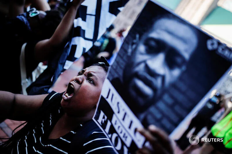  A protester reacts while gathering with others outside the city hall after a white police officer was caught on a bystander's video pressing his knee into the neck of African-American man George Floyd, who later died at a hospital, in Minneapolis, M