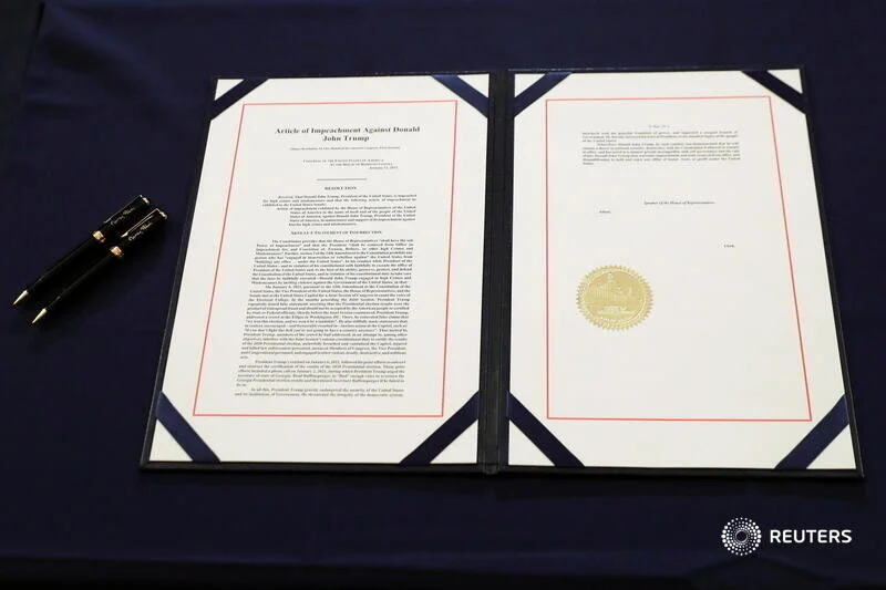  The article of impeachment against U.S. President Donald Trump, which U.S. House Speaker Nancy Pelosi (D-CA) will sign in an engrossment ceremony, is seen at the U.S. Capitol in Washington January 13, 2021. REUTERS/Leah Millis  