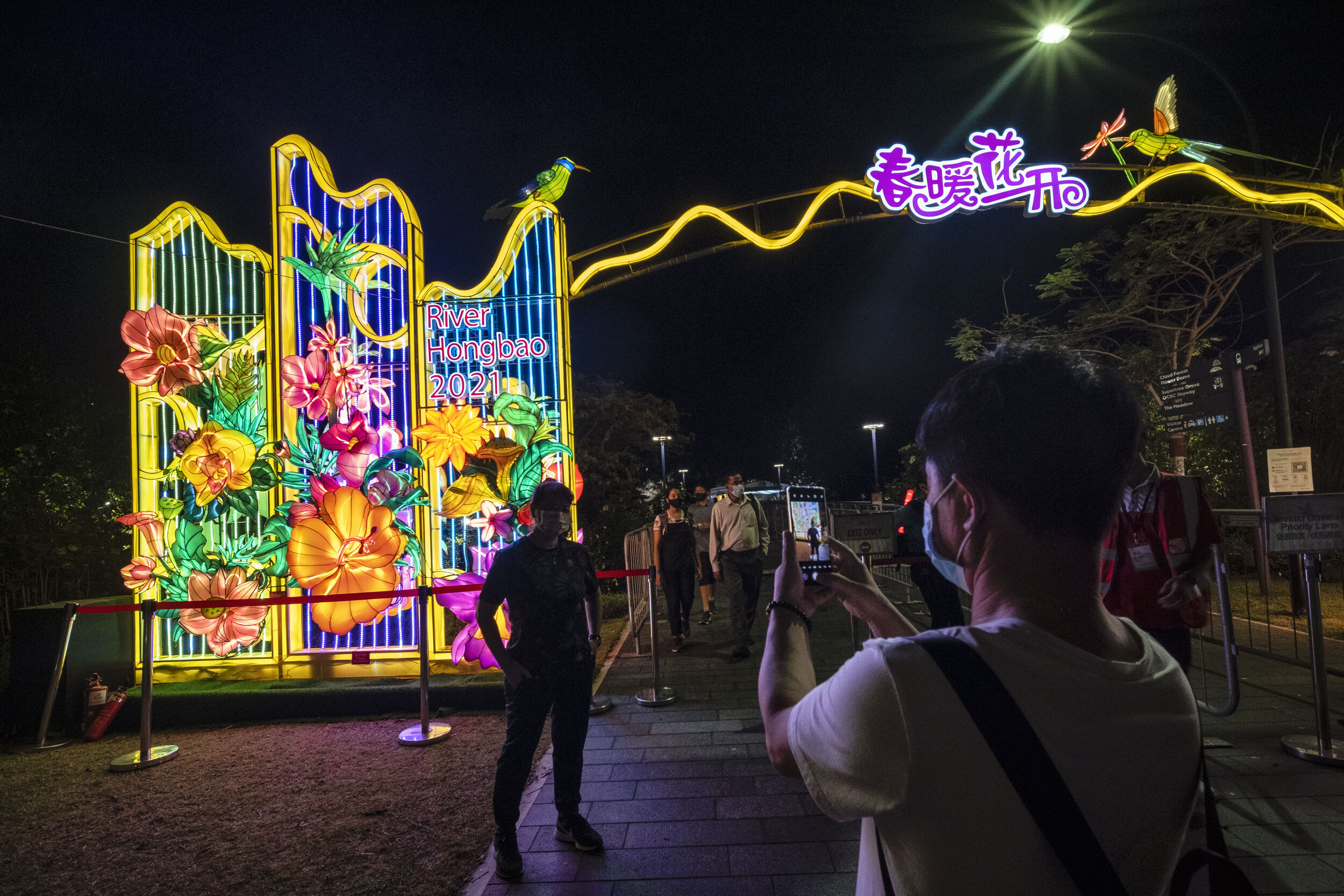  Visitors wearing face masks are seen at one of the entrances of the annual River Hongbao festival on the eve of the Chinese Lunar New Year of the Ox, otherwise known as the Spring Festival, at Singapore's Gardens by the Bay, February 11, 2021. REUTE
