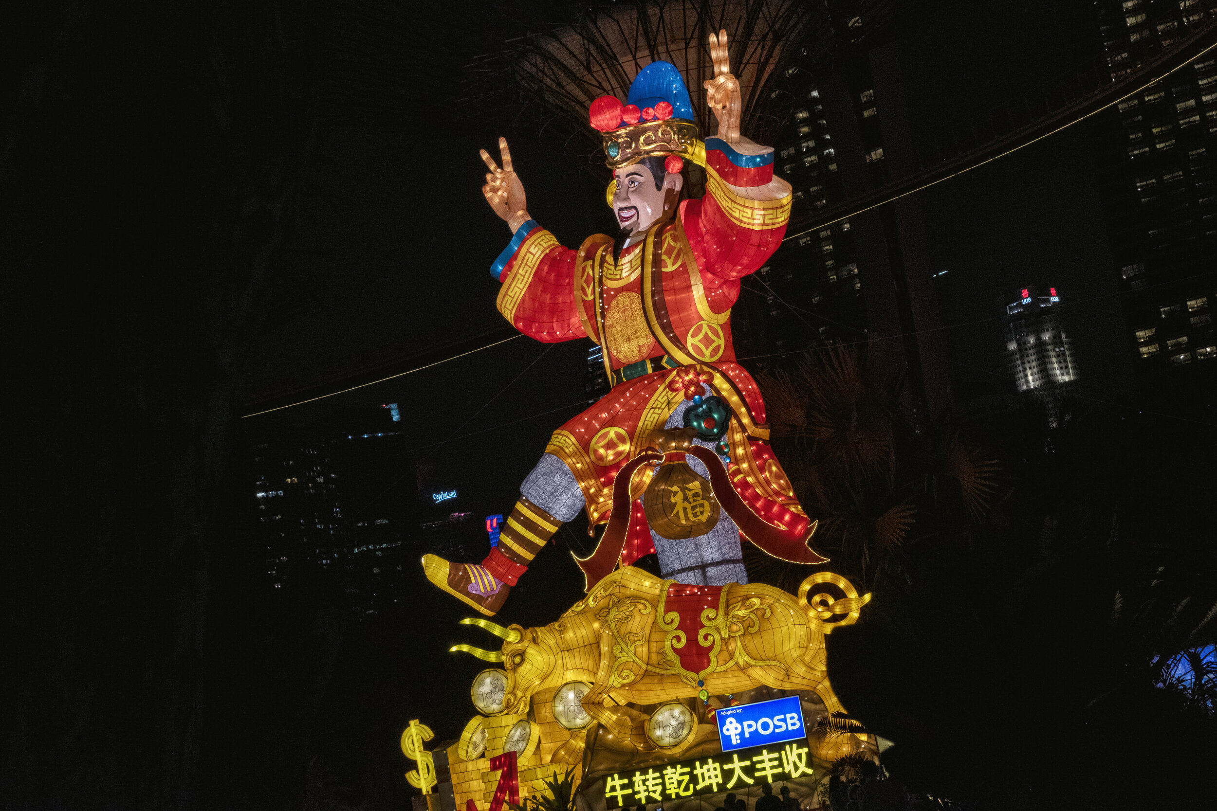  A giant lantern depicting Caishen, the god of fortune, money and a golden ox is seen during the annual River Hongbao festival on the eve of the Chinese Lunar New Year of the Ox, otherwise known as the Spring Festival, at Singapore's Gardens by the B