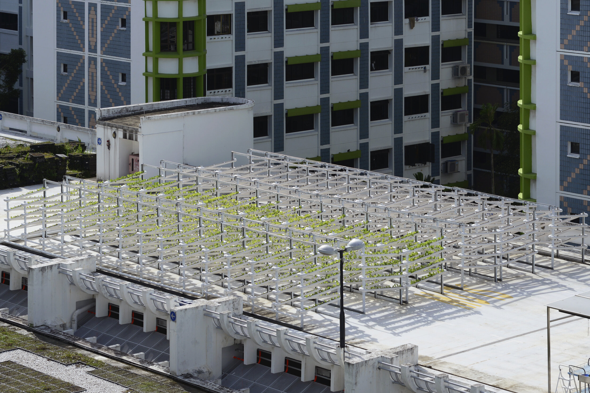  An aerial view shows Citiponics' urban farm located on the rooftop of a multi-storey carpark in a public housing estate in western Singapore 