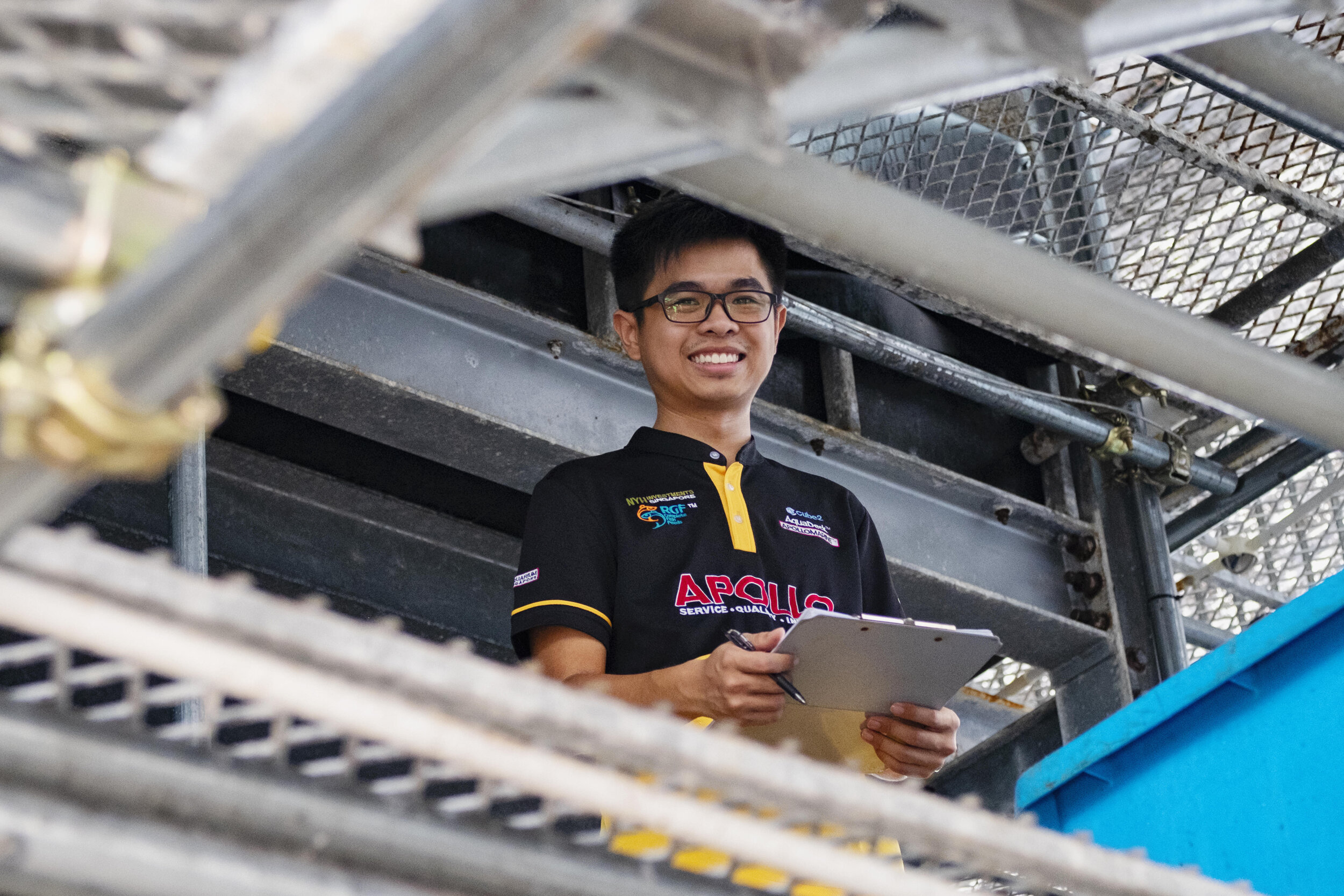  Aquaculture specialist Nick Goh smiles from the second level of Apollo Aquaculture Group’s three-tiered vertical fish farm in northern Singapore 