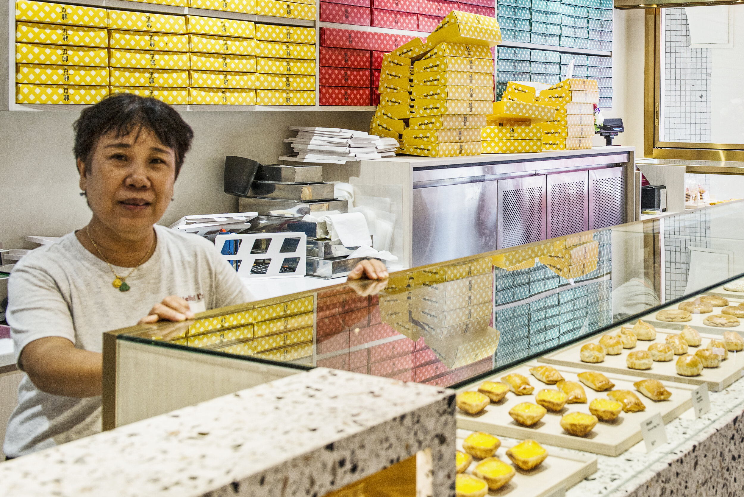  An employee poses for a photograph at traditional Cantonese confectionery Tong Heng in Singapore April 21, 2018. 