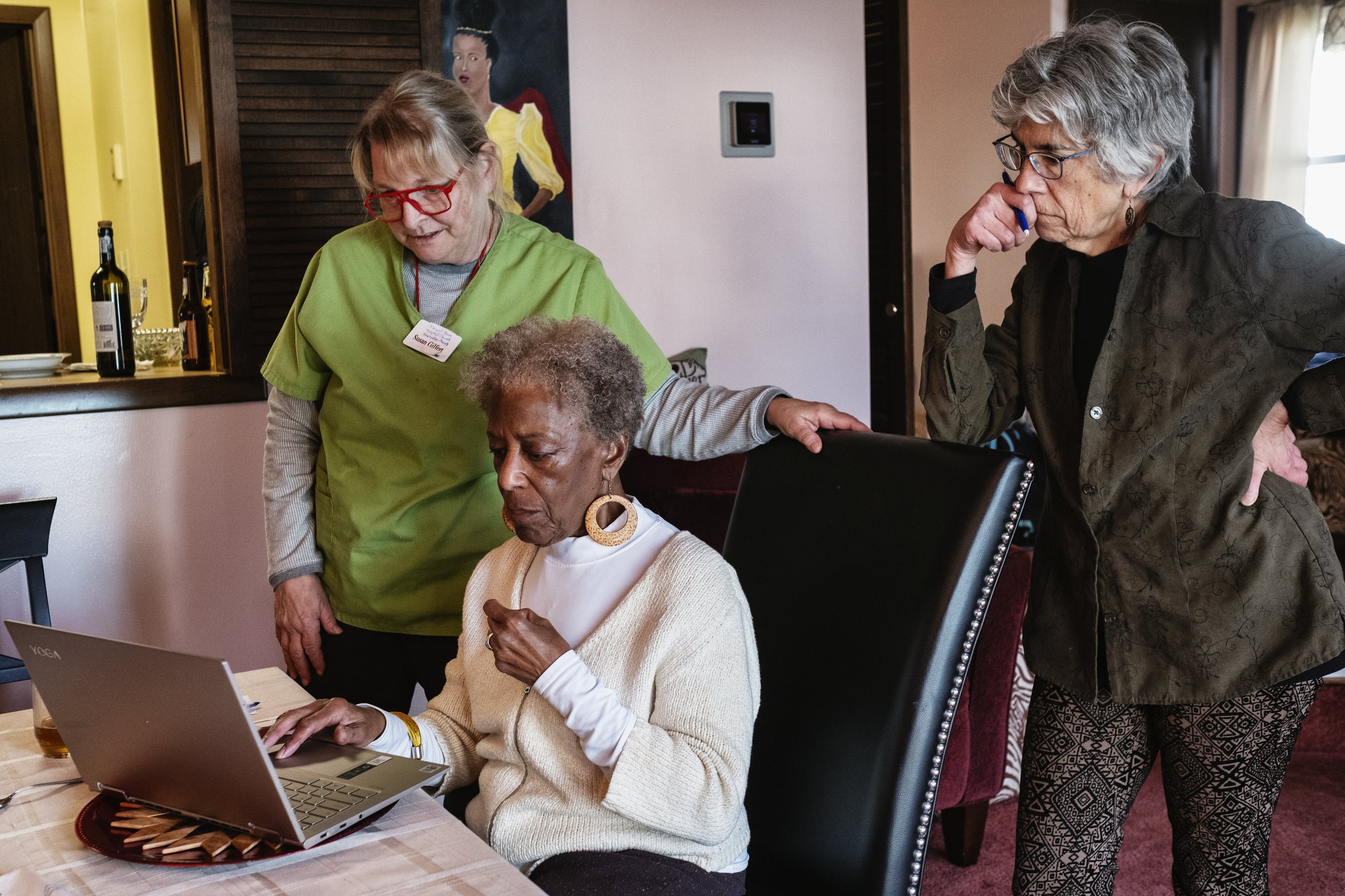  Dr. Tee Ford-Ahmed discusses the steps to registering the copyright to the "Black Wall Street Athens" documentary with the U.S. Copyright Office with fellow Mount Zion Baptist Church Preservation Society members Susan Gilfert and Dr. Susan Righi in 