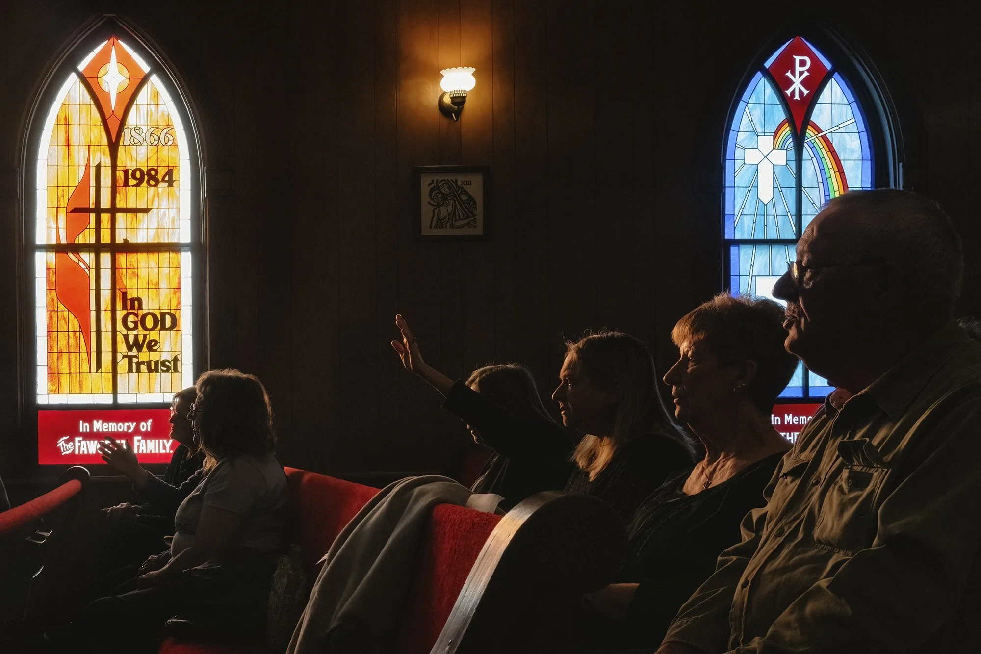  Light shines through the stained glass windows of Chesterhill Christian Church as people react during a Lenten service held in the Chesterhill Christian Church in Chesterhill, Ohio, Sunday, March 17, 2024. According to Jeanie Voland, an active membe