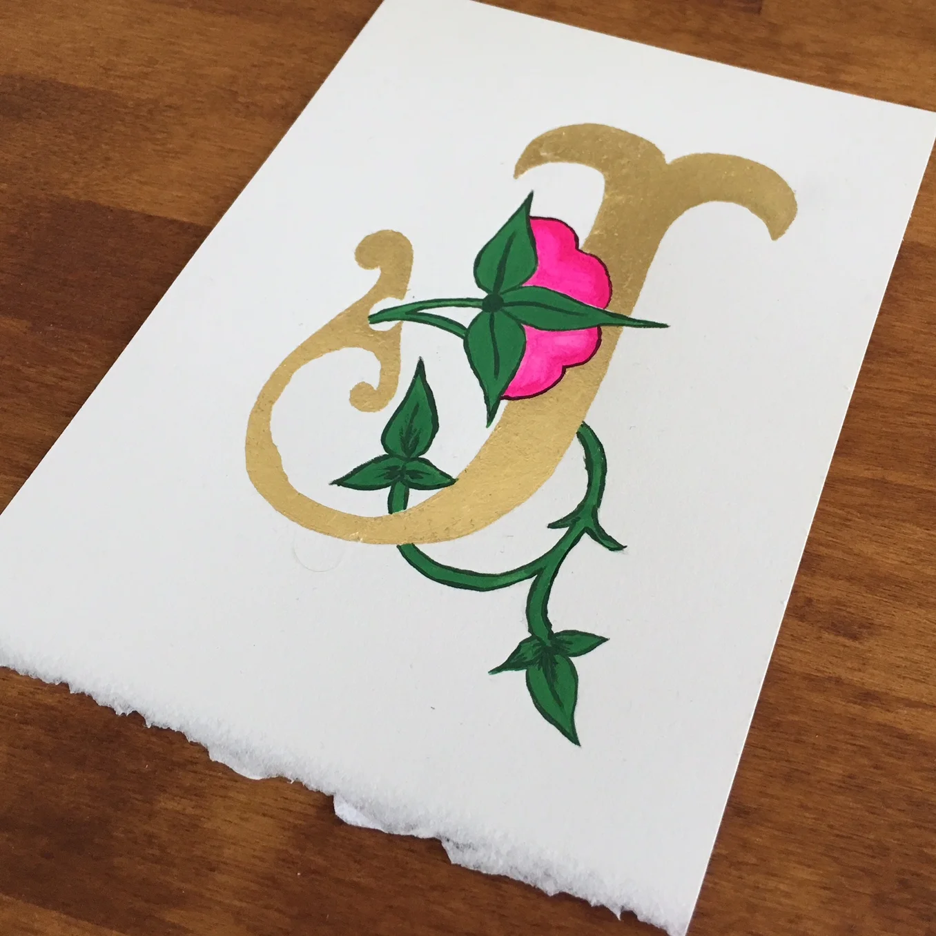 Decorated letter :: Gold "J" with pink flower :: Opaline Lettering