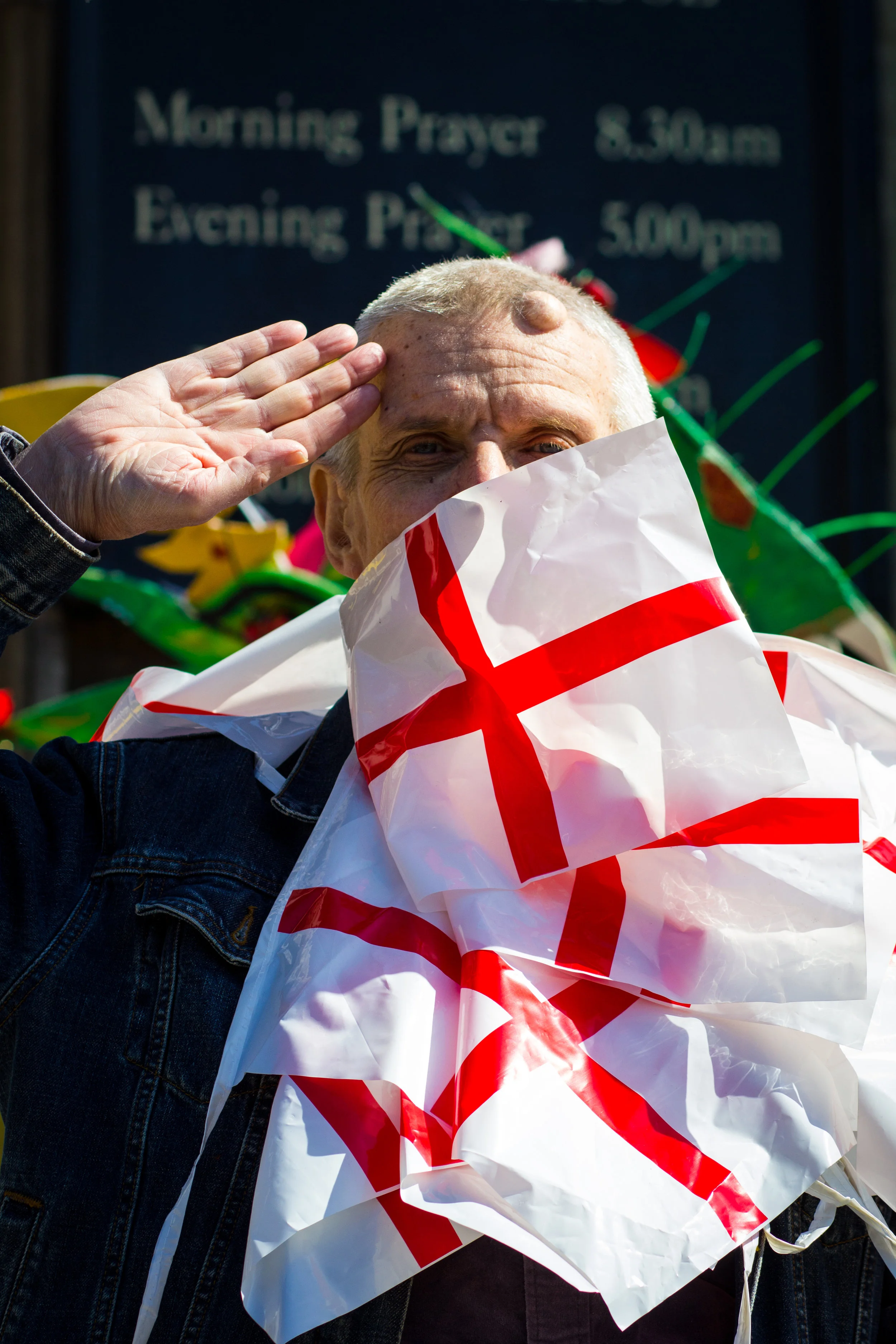 Frank, St George’s Day, 2014 The Dragon Café is based in the crypt of St George the Martyr, Borough. St George had a special resonance with the founder Sarah Wheeler, and so every year The Dragon Café holds a parade down Borough High Street, London’s only celebration of the multi-cultural history of St George. Frank, a prolific poet and empassioned performer, wrapped himself in bunting in perparation for the march.