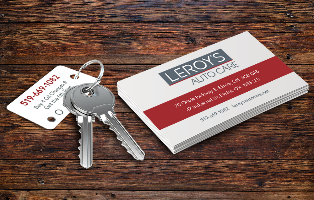 Laminated oil change key tags and new business cards carry the new Leroy's look.