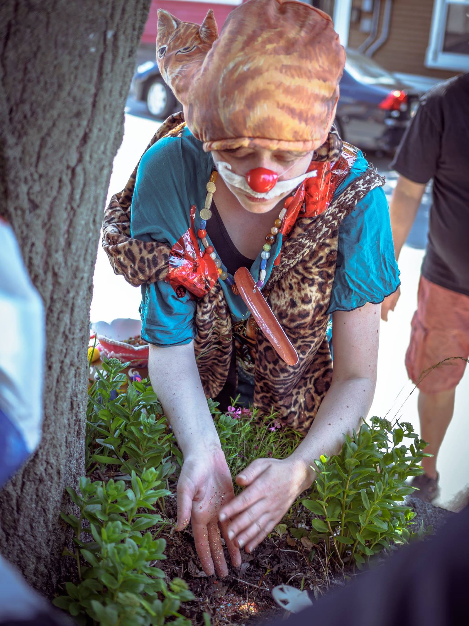  Wiener Shaman plants a Sacred Mixture of plant seeds, glitter, bacon bits, and ashes of fellow clown and artist, David Tuck. Photo by Ritchie Perez. 