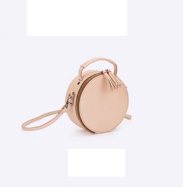 Round shoulder bag by Apipi Leather