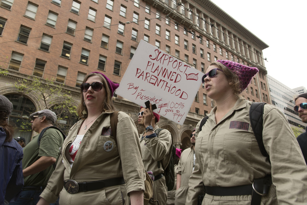A group of men and women, dressed in Ghosbuster’s costumes and donning “pussyhats”, take part in the April 15, 2017 Tax March in San Francisco, holding a sign supporting Planned Parenthood. Throughout his political career and before becoming vice president, Mike Pence has supported multiple bills that aim to defund Planned Parenthood. In March 2017, he broke a tie on a legislative bill that allows states to withhold federal funding to health care providers that provide abortion services, like Planned Parenthood. Despite this setback, Planned Parenthood has seen a huge spike in donations and volunteers since Trump won the presidency in November. 
