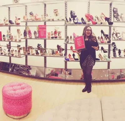 Showin' off promos in shoes as a Sales Associate at Charlotte Russe!