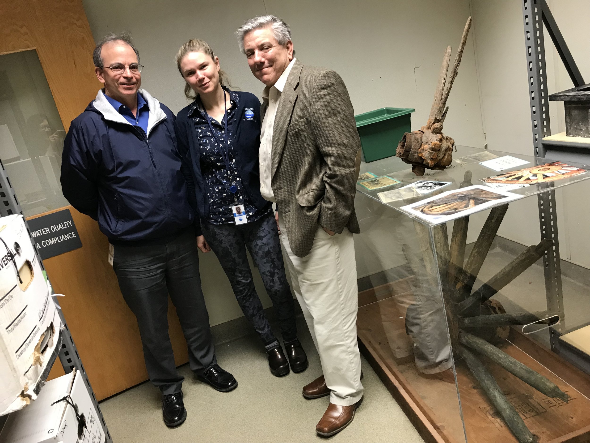 Left to right: John Motta, Kerri Van Houghton and Tom Uva at Narragansett Bay Commission with wagon wheel (below) and car tire (above).