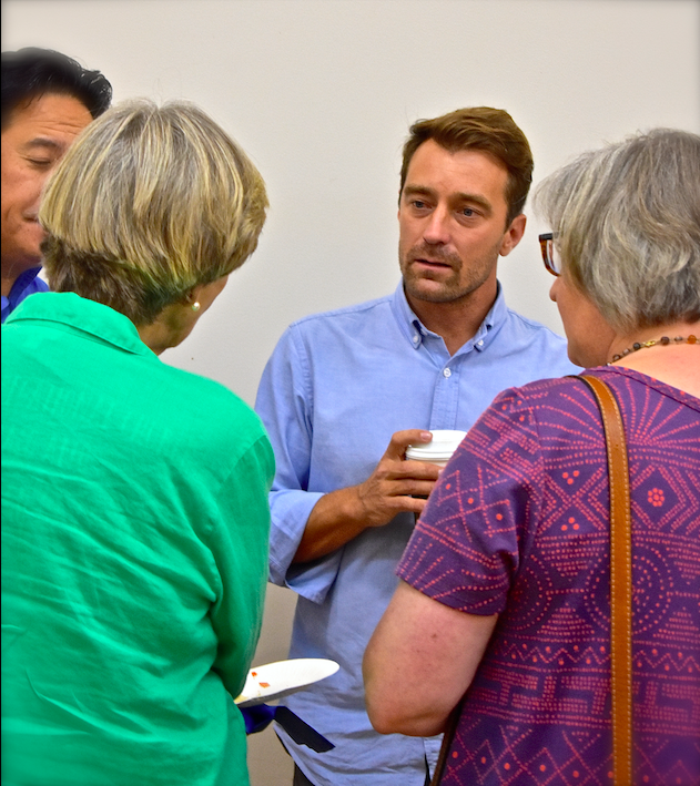 Noah talks with guests at All Saints' Palo Alto reception, Sept. 9