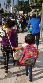 A family leaves with the second caravan.