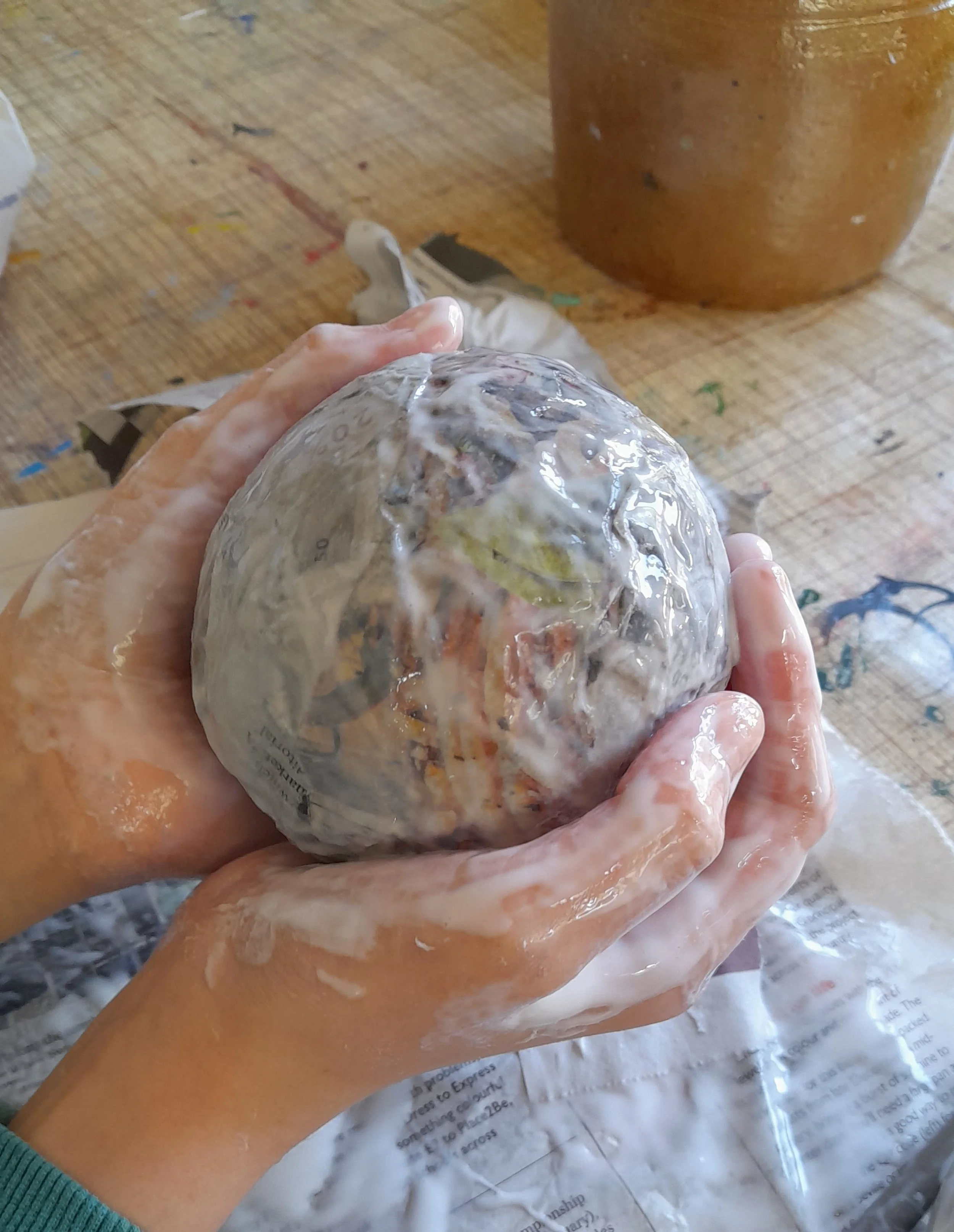 a papier mache paper sphere