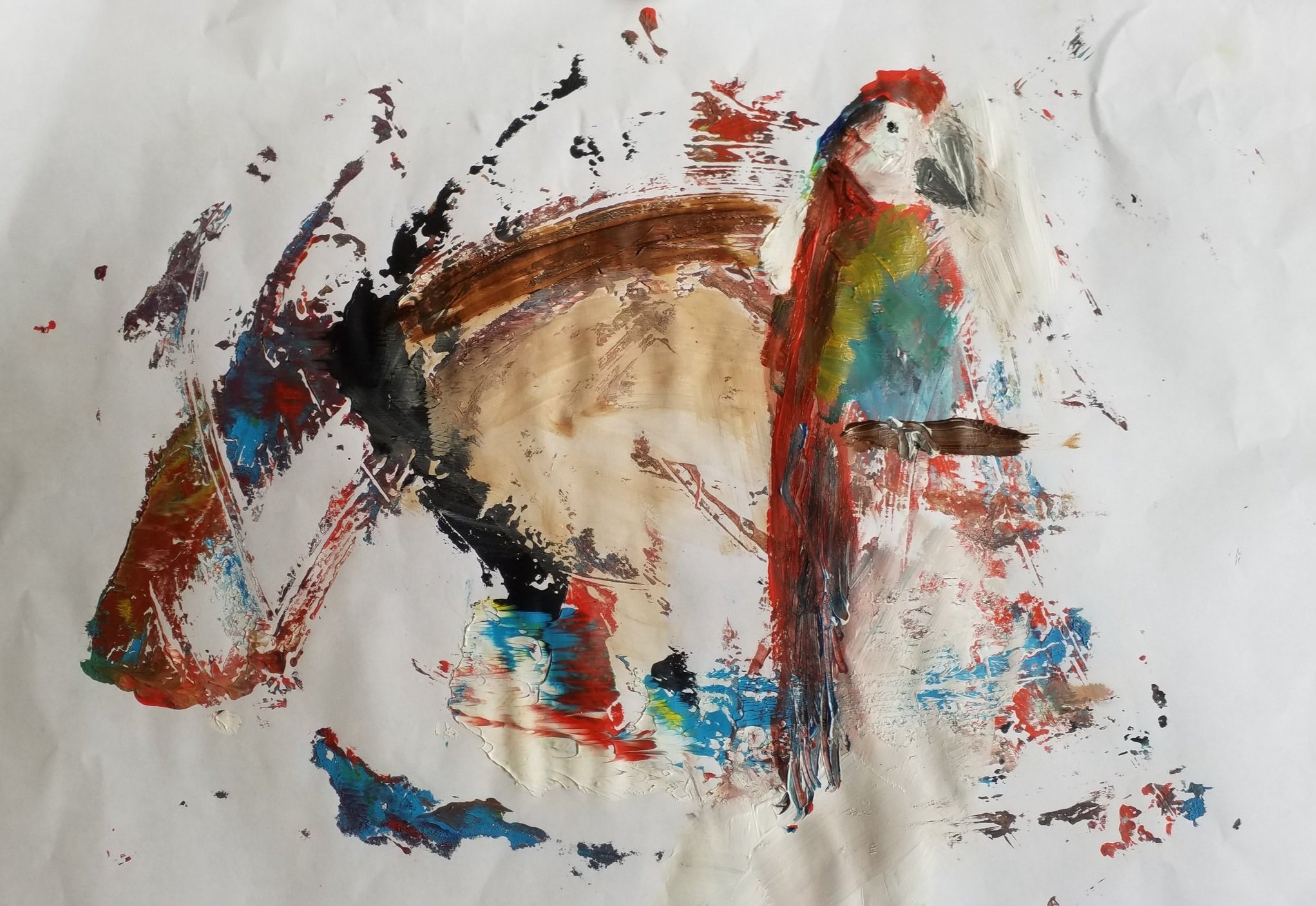 Acrylic parrot appearing in random acrylic paint spread on the background of a white sheet.