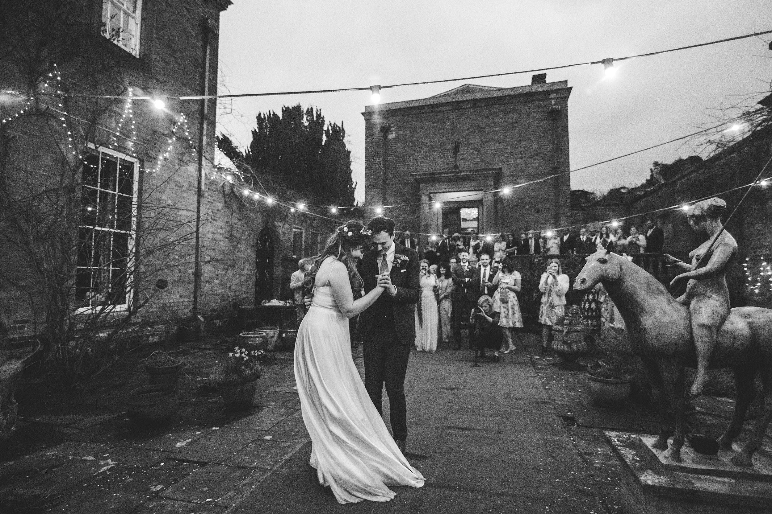 Festoon lighting first dance wedding photography