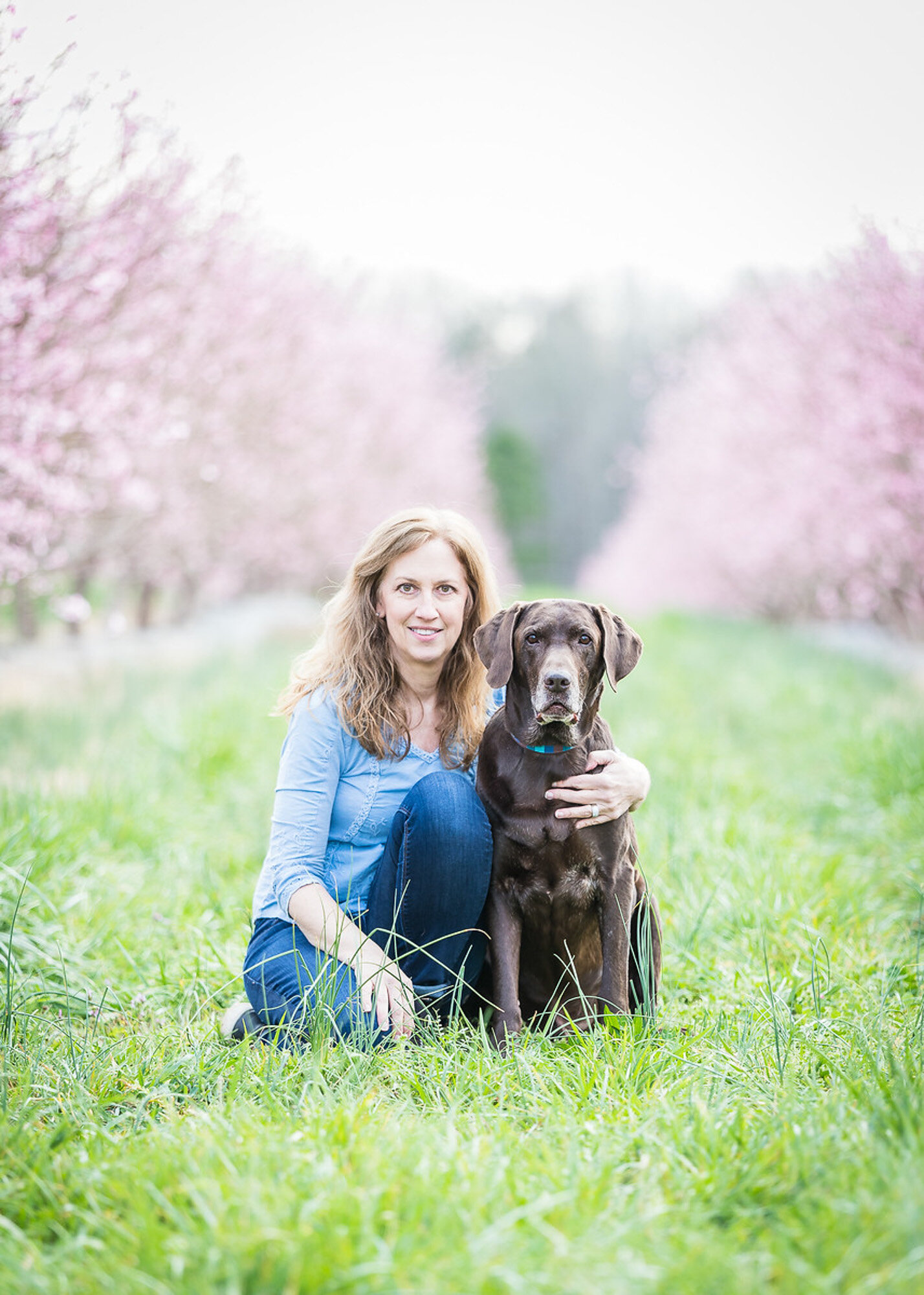 pro dog photographer and her chocolate lab Moose