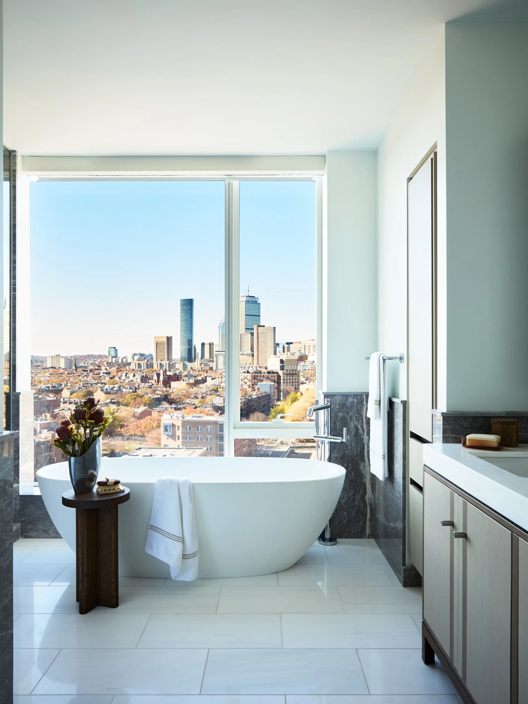 Skyline sophistication primary bathroom bathtub shower and custom vanity interior design by Trevor Fulmer