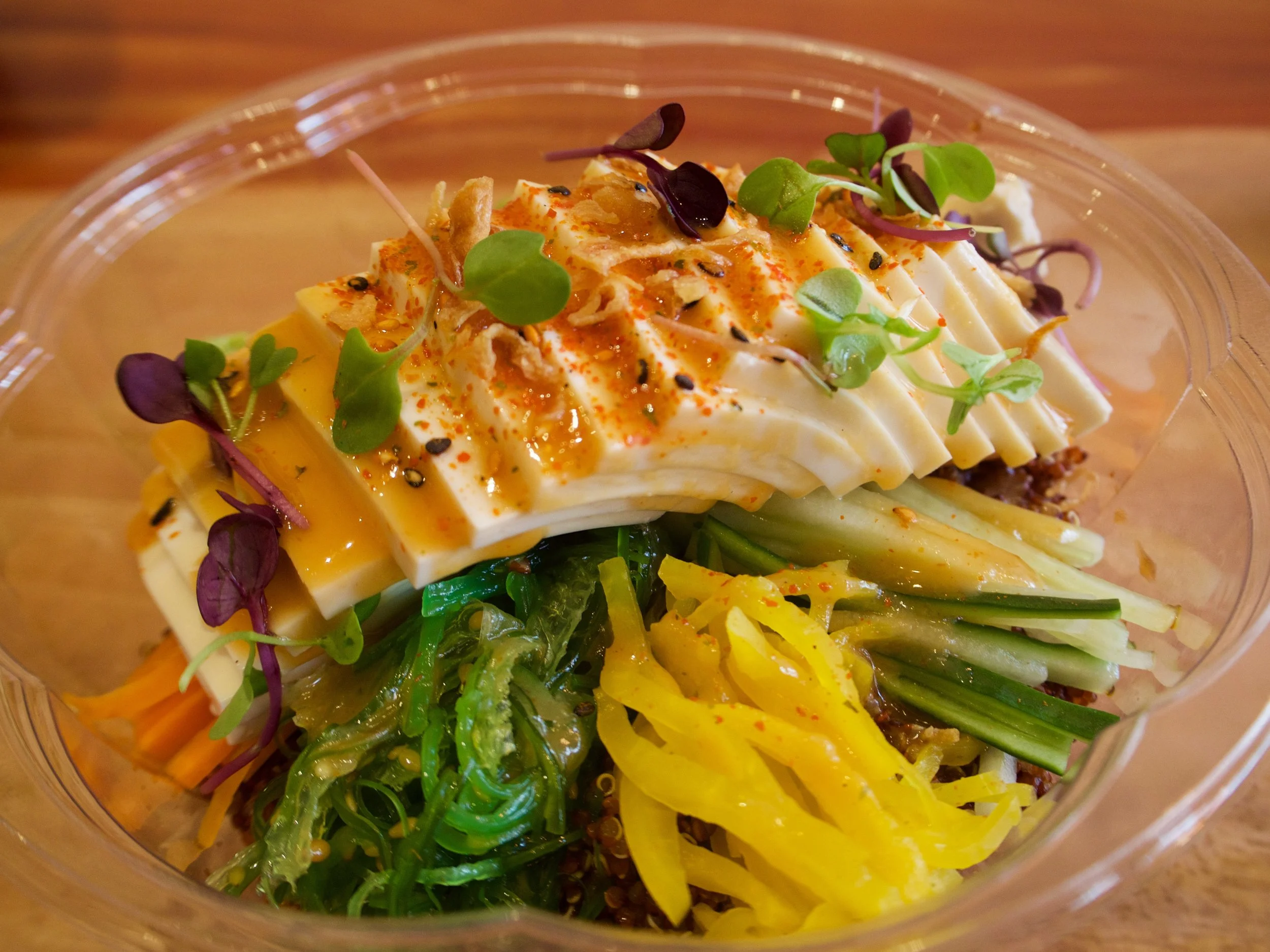 The organic tofu bowl is a great vegetarian option. The tofu bowl includes miso glaze, avocado, seasonal veggies, cucumber, edamame, picked ginger, oshinko (pickled daikon), micro mix (pictured is micro cilantro), togarashi and garlic chips aka “crunchies” 