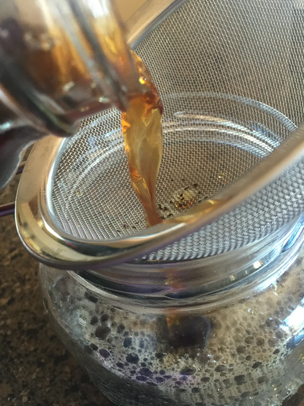 Straining out the Black Tea leaves, so I just have brewed black tea in the half-gallon jar.