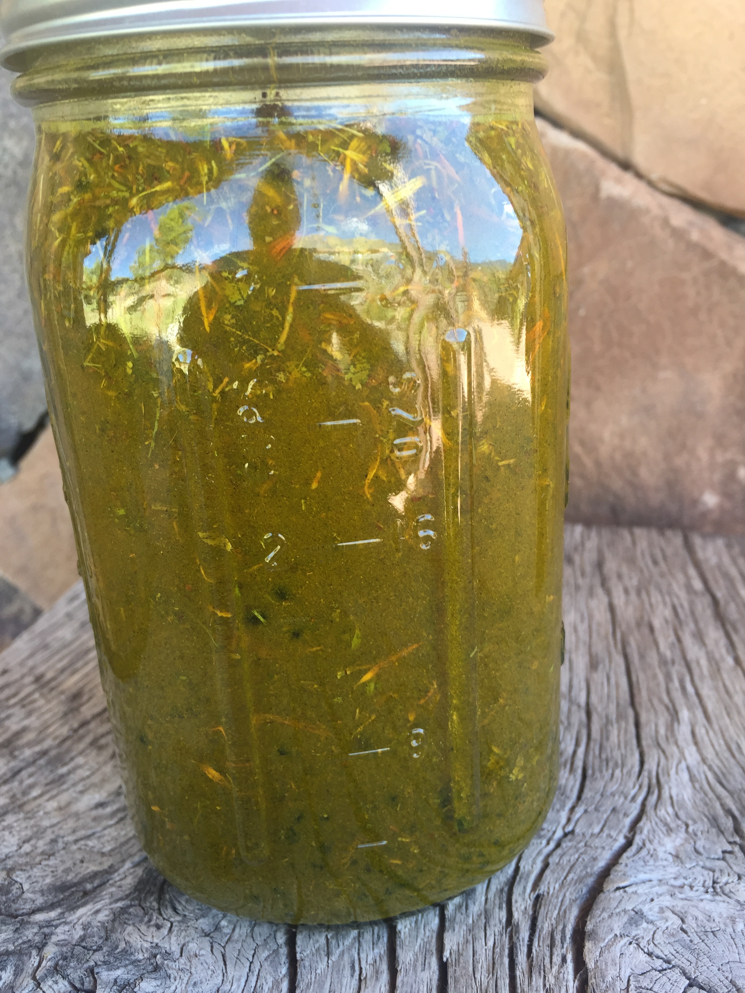 Here is the shaken mixture of herbs and alcohol. It looks pretty "muddy" right now due to the powders. The herbs will settle to the bottom.