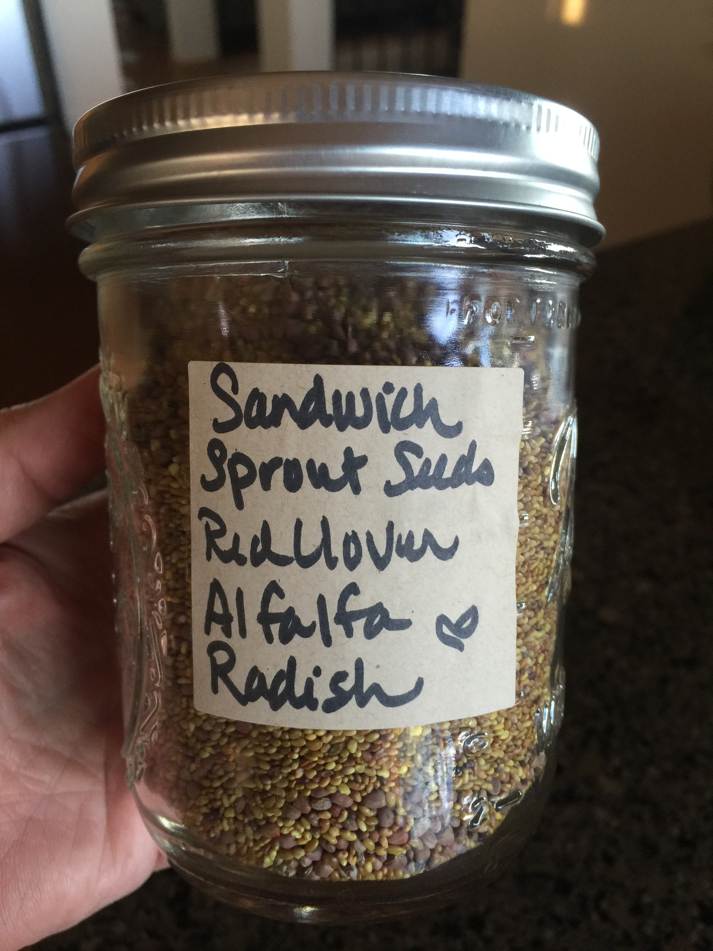 This is Starwest Botanicals ' Sandwich Blend of sprouting seeds. Radish, Alfalfa, and Red Clover. The seeds arrive in an airtight bag, but I like to store mine in a labeled jar with a tight lid. I like my seeds fresh as can be! 
