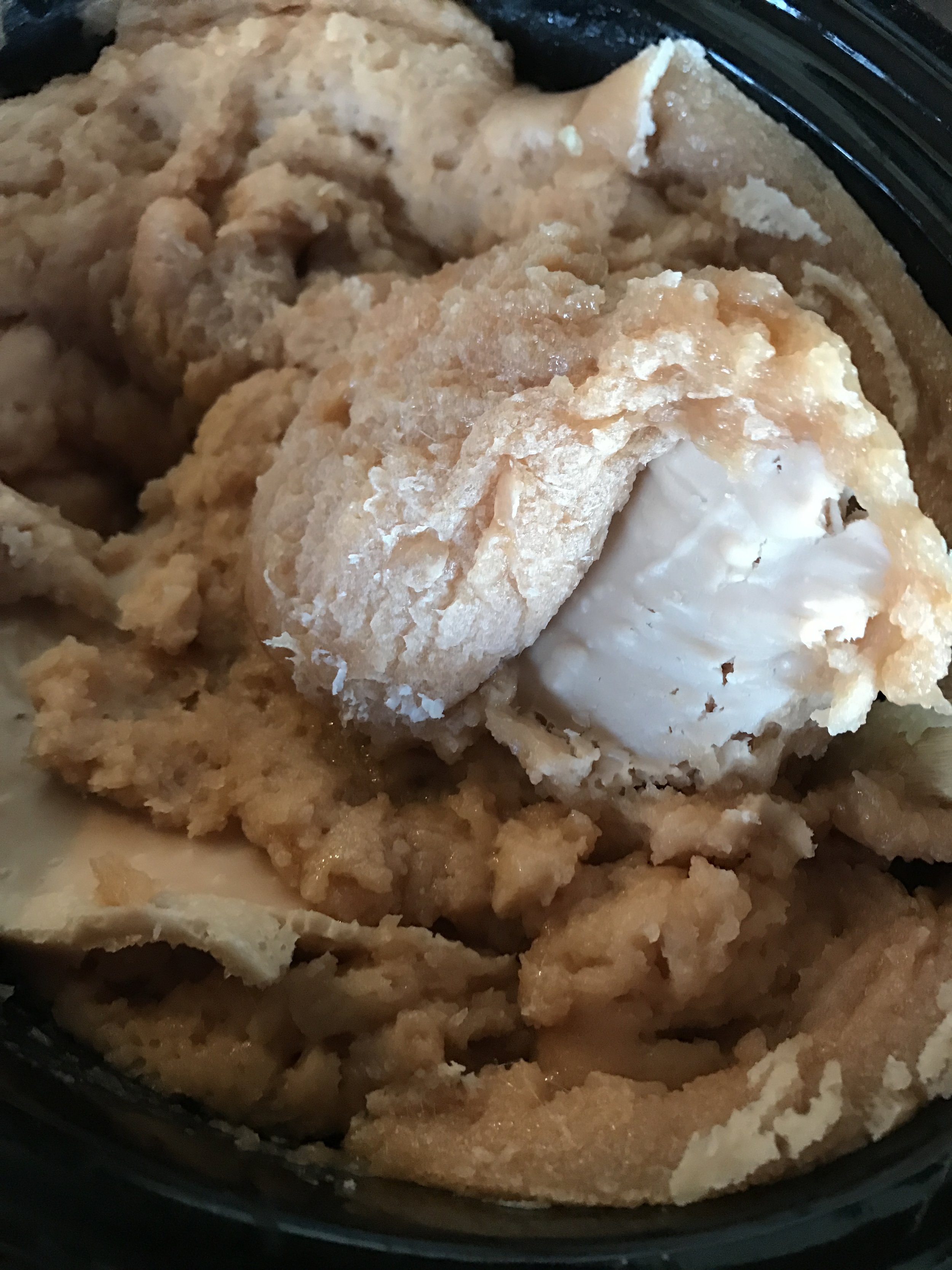 This picture shows the semi-cooked soap. The saponification process (where the sodium hydroxide turns the oils into actual soap) is happening, but there are still very opaque areas. If these are still in the mixture, then it's caustic!