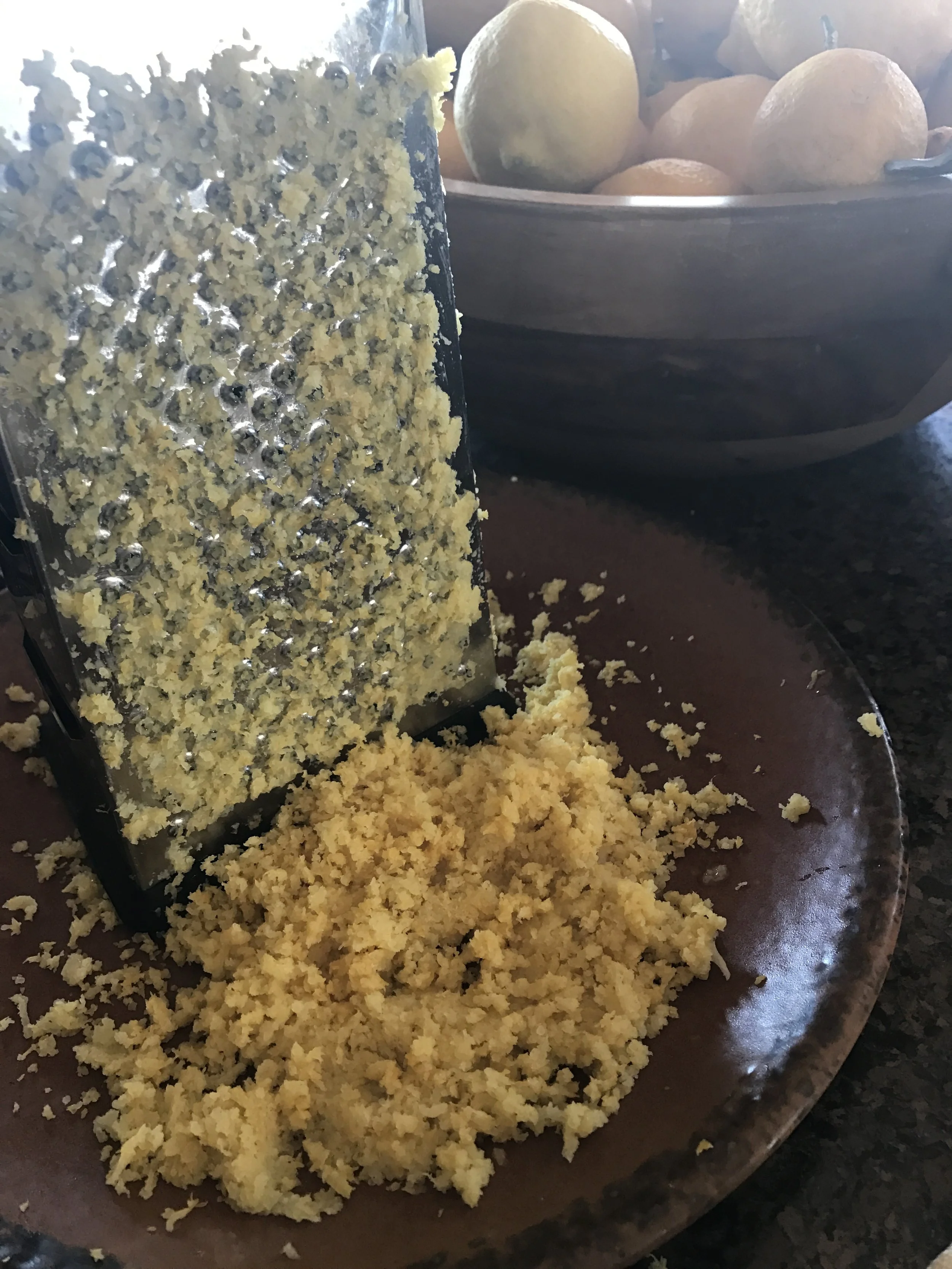 Zesting the lemons---I just used the fine side of a cheese grater, but you can buy a zester specifically for this purpose. 