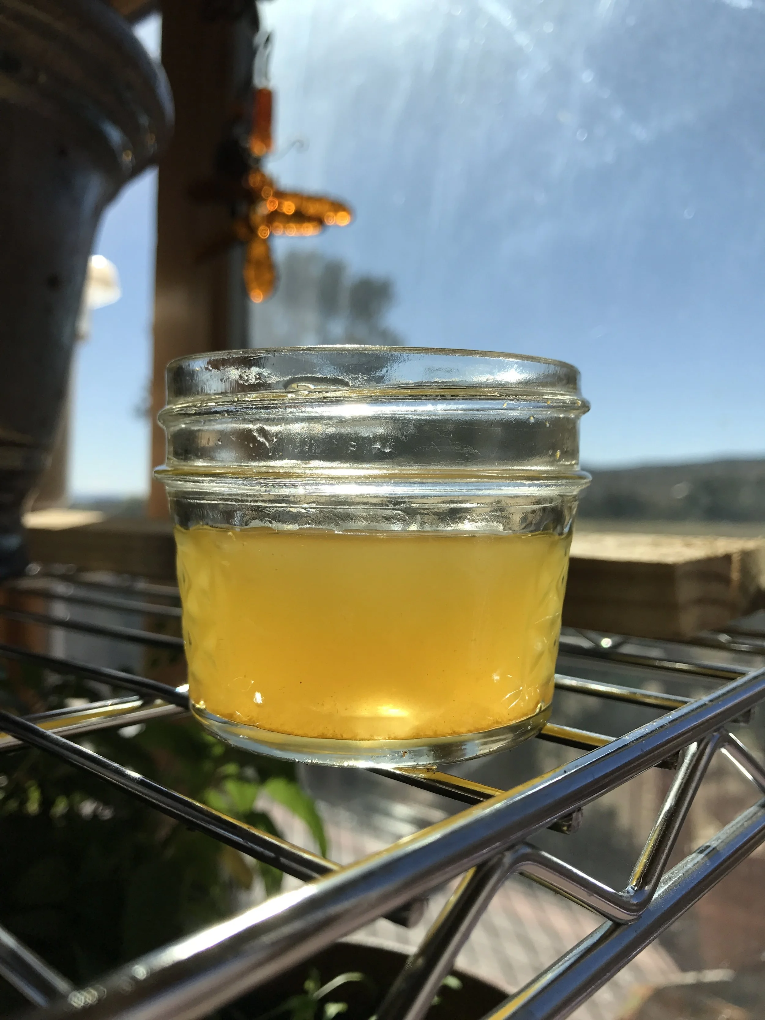 And here is a little 4 ounce glass of the finished lovely golden beet & turmeric kvass! Mmmmm...!