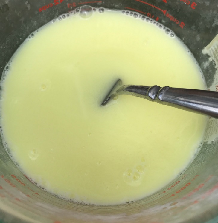 This is the goat milk, water, and lye solution all mixed up. Look at that beautiful color, and the goat milk was cold enough that it didn't burn! So far, so good!