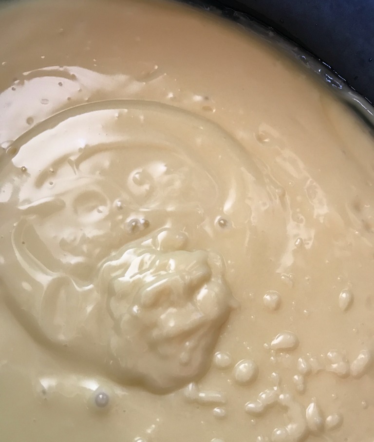 This is how the soap mixture looks like at trace in the crock pot. Interestingly, as this soap began its "cook," it first turned into a hard block of opaque soap (still VERY caustic) with the trace marks still there!
