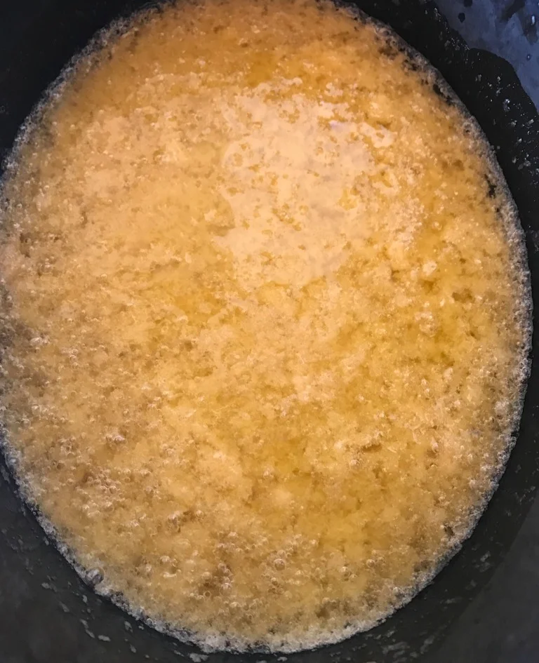 OH, NO!!!!! This is NOT a good sign when making hot process soap. Basically, the oils and liquids are separating, and unless something is done fast (re-emulsification), the chemical reaction that changes the molecular structure of the oils won't happen. What's left? A big caustic mess.